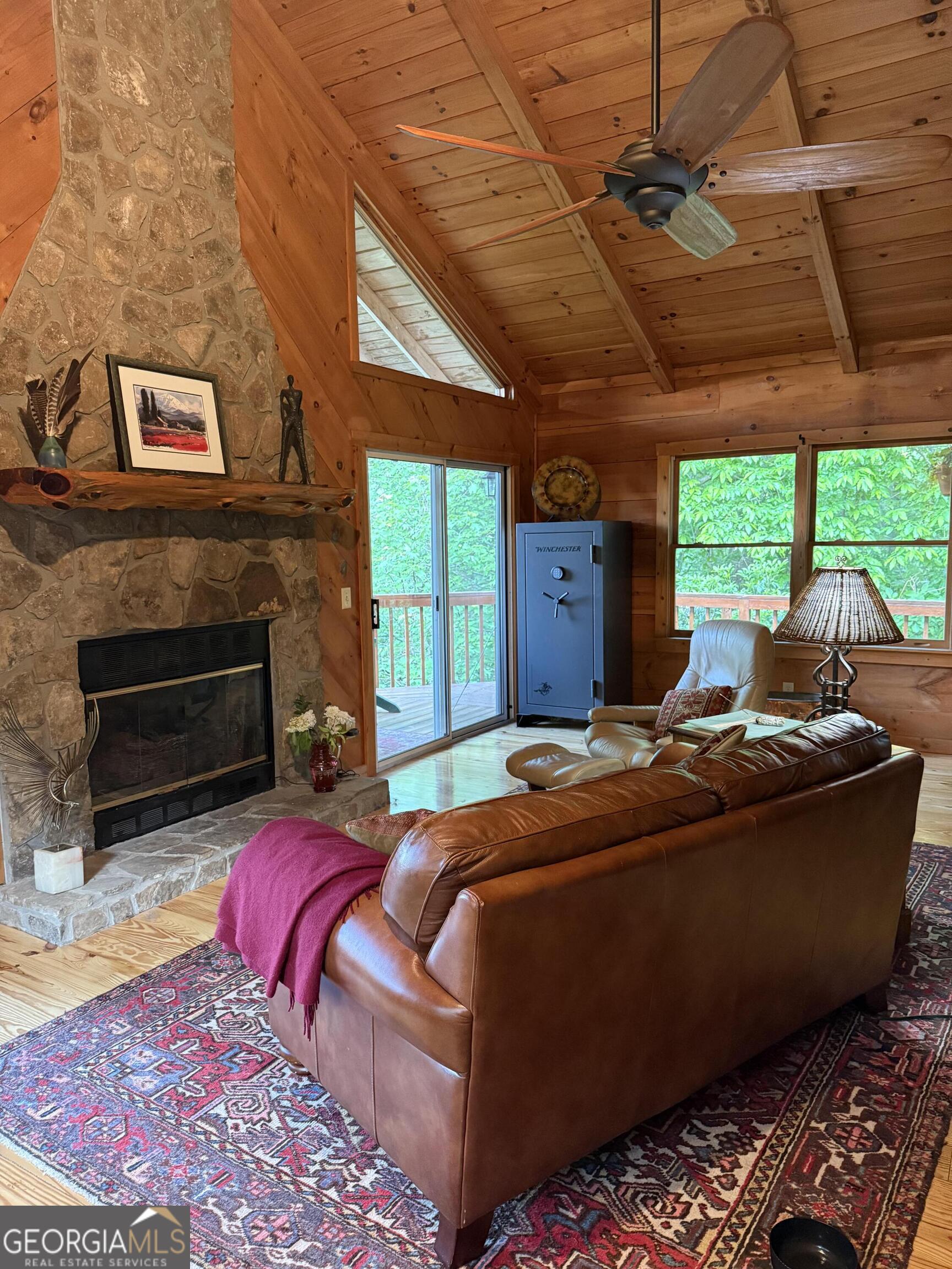 44 Cessna Lane Rabun Gap, GA 30568 - Photo 6 of 27 a bed room with a bed and a fireplace