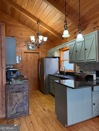 a kitchen with stainless steel appliances granite countertop a stove and a refrigerator