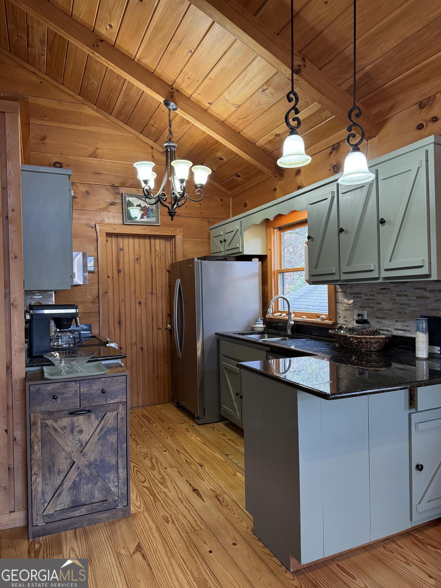 44 Cessna Lane Rabun Gap, GA 30568 - Photo 9 of 27 a kitchen with stainless steel appliances granite countertop a stove and a refrigerator