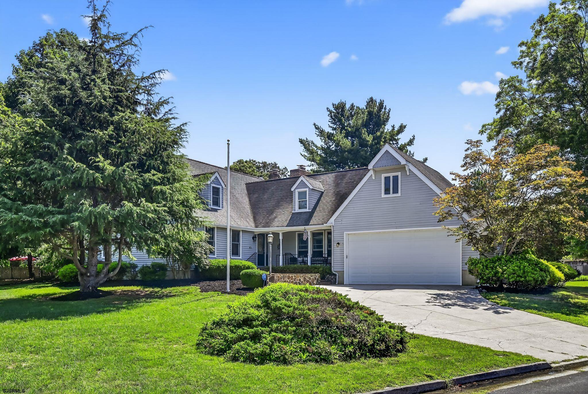 404 Cedarbrook Lane Linwood, NJ 08221 - Photo 1 of 33 a front view of a house with a yard