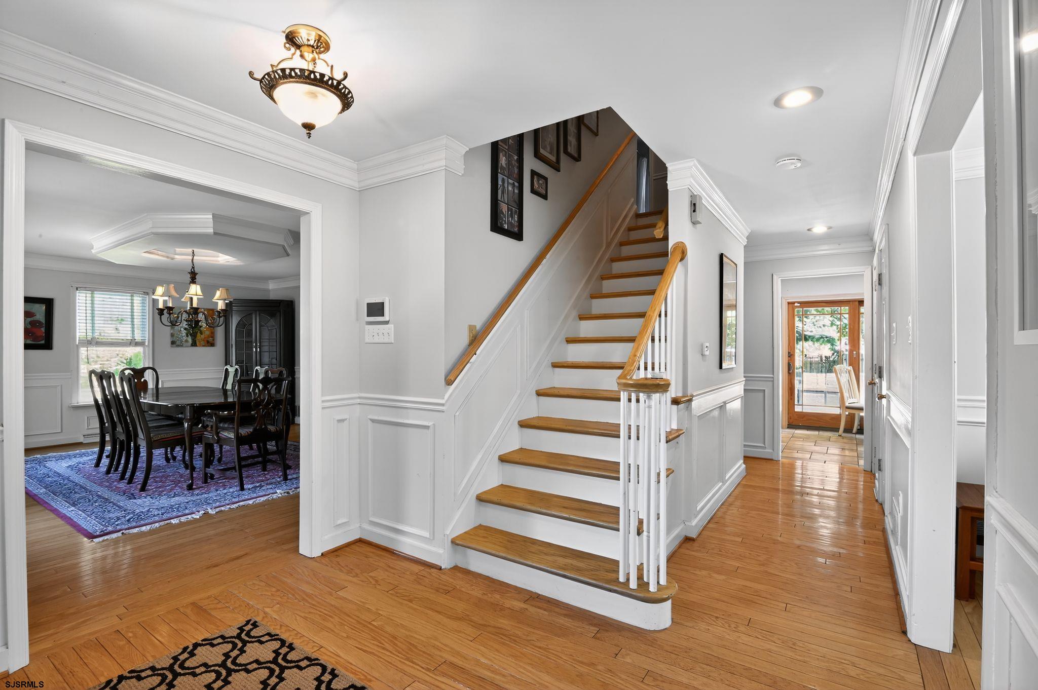 404 Cedarbrook Lane Linwood, NJ 08221 - Photo 11 of 33 a view of entryway and hall with wooden floor