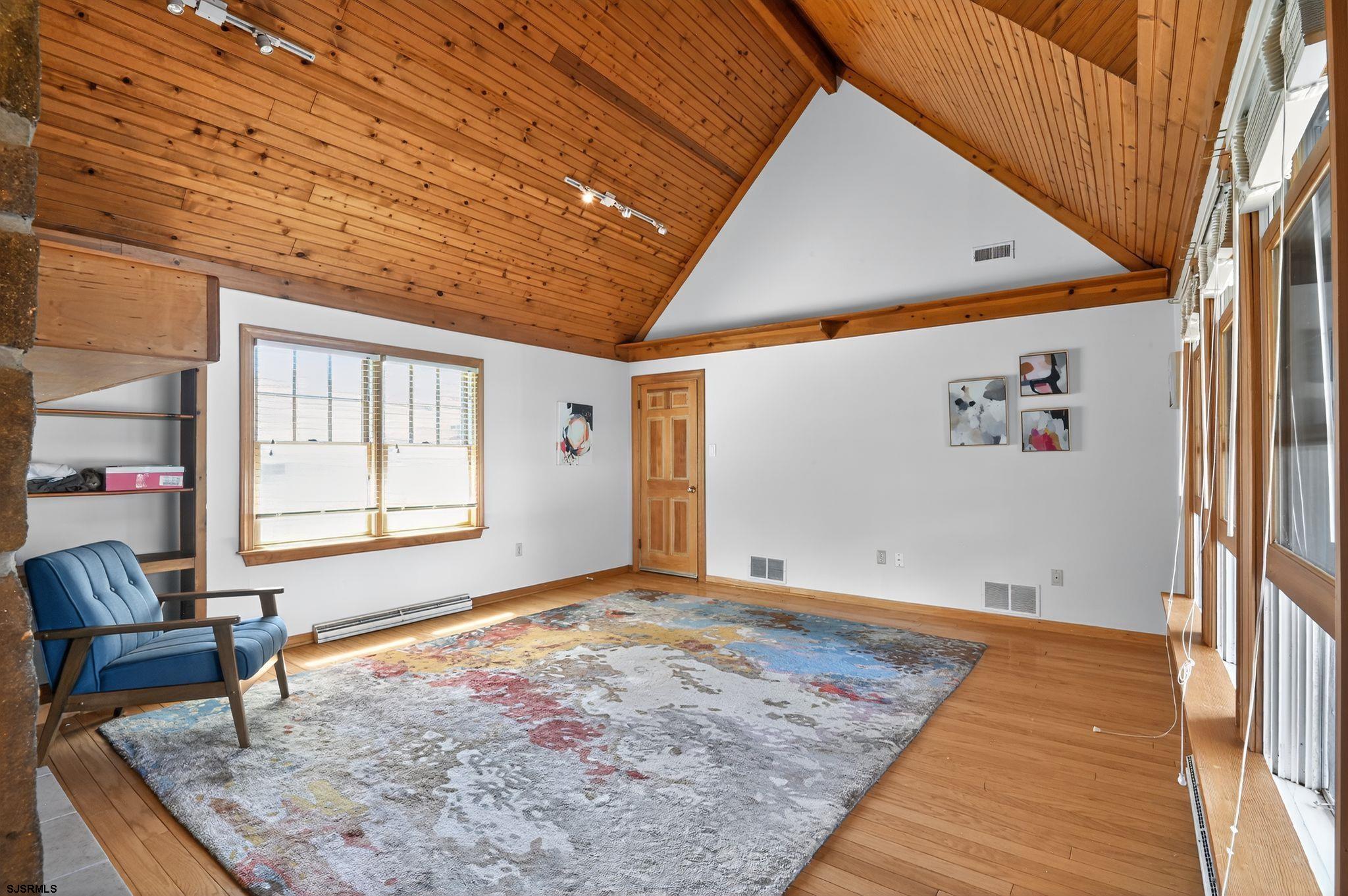 404 Cedarbrook Lane Linwood, NJ 08221 - Photo 13 of 33 a living room with a rug