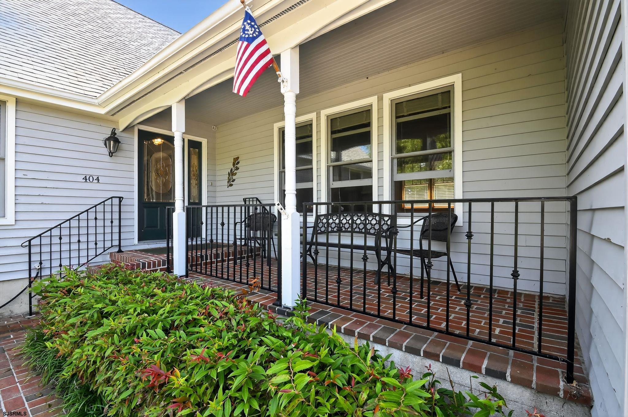 404 Cedarbrook Lane Linwood, NJ 08221 - Photo 2 of 33 a front view of a house with a porch