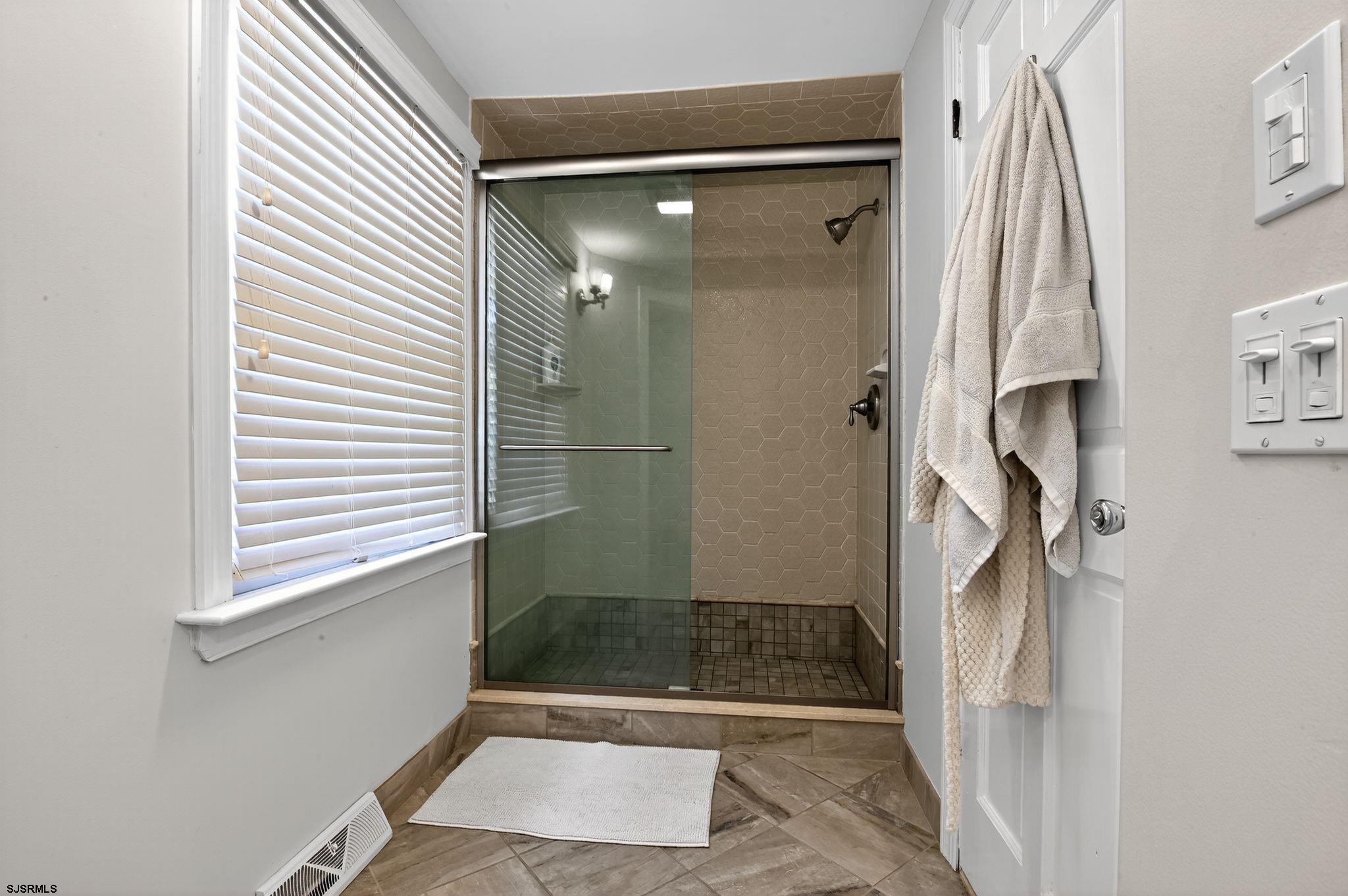 404 Cedarbrook Lane Linwood, NJ 08221 - Photo 22 of 33 a bathroom with a shower