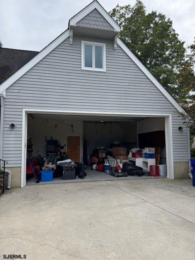404 Cedarbrook Lane Linwood, NJ 08221 - Photo 31 of 33 a view of a garage with parked cars