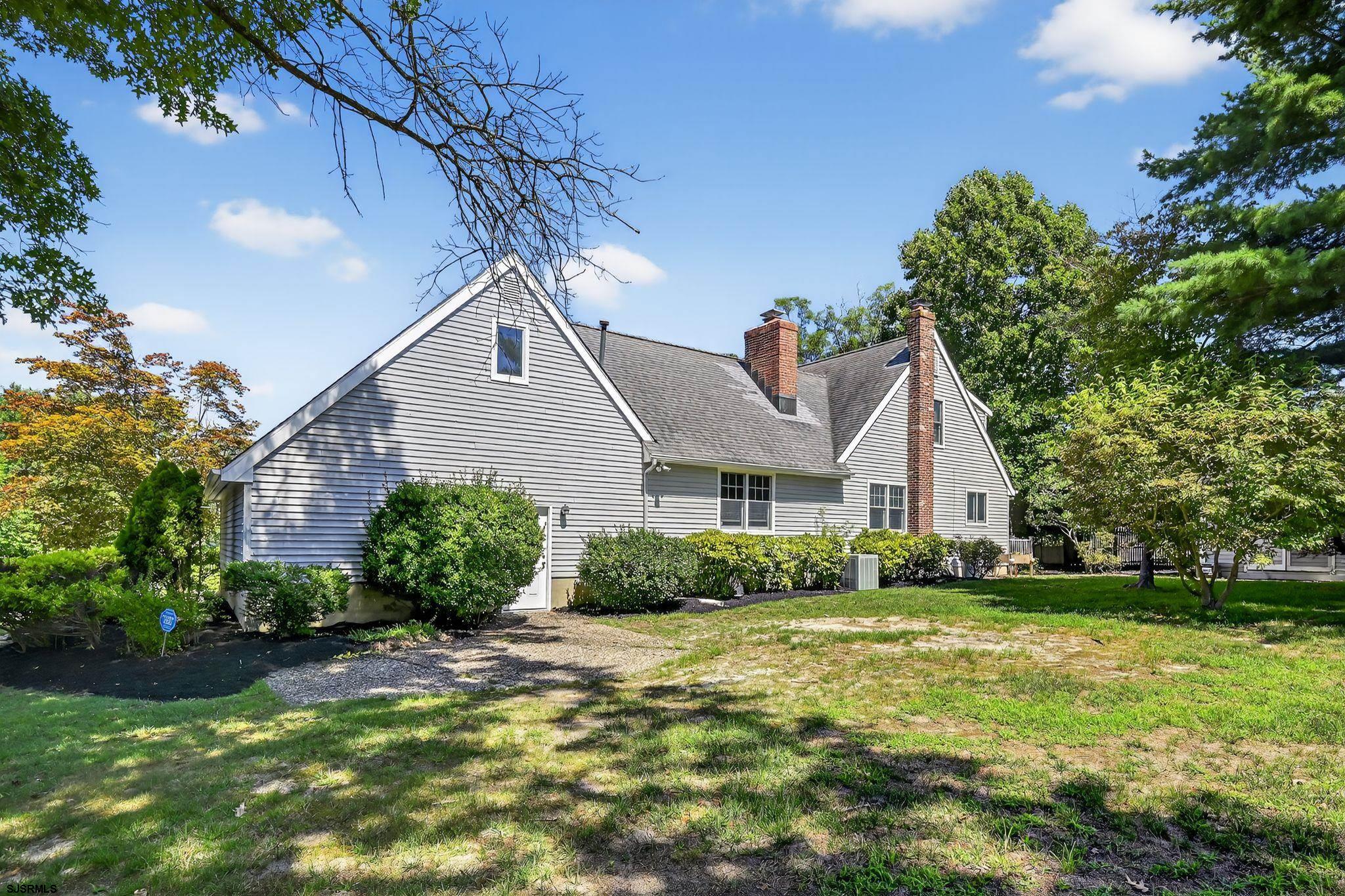 404 Cedarbrook Lane Linwood, NJ 08221 - Photo 4 of 33 a front view of house with yard and green space
