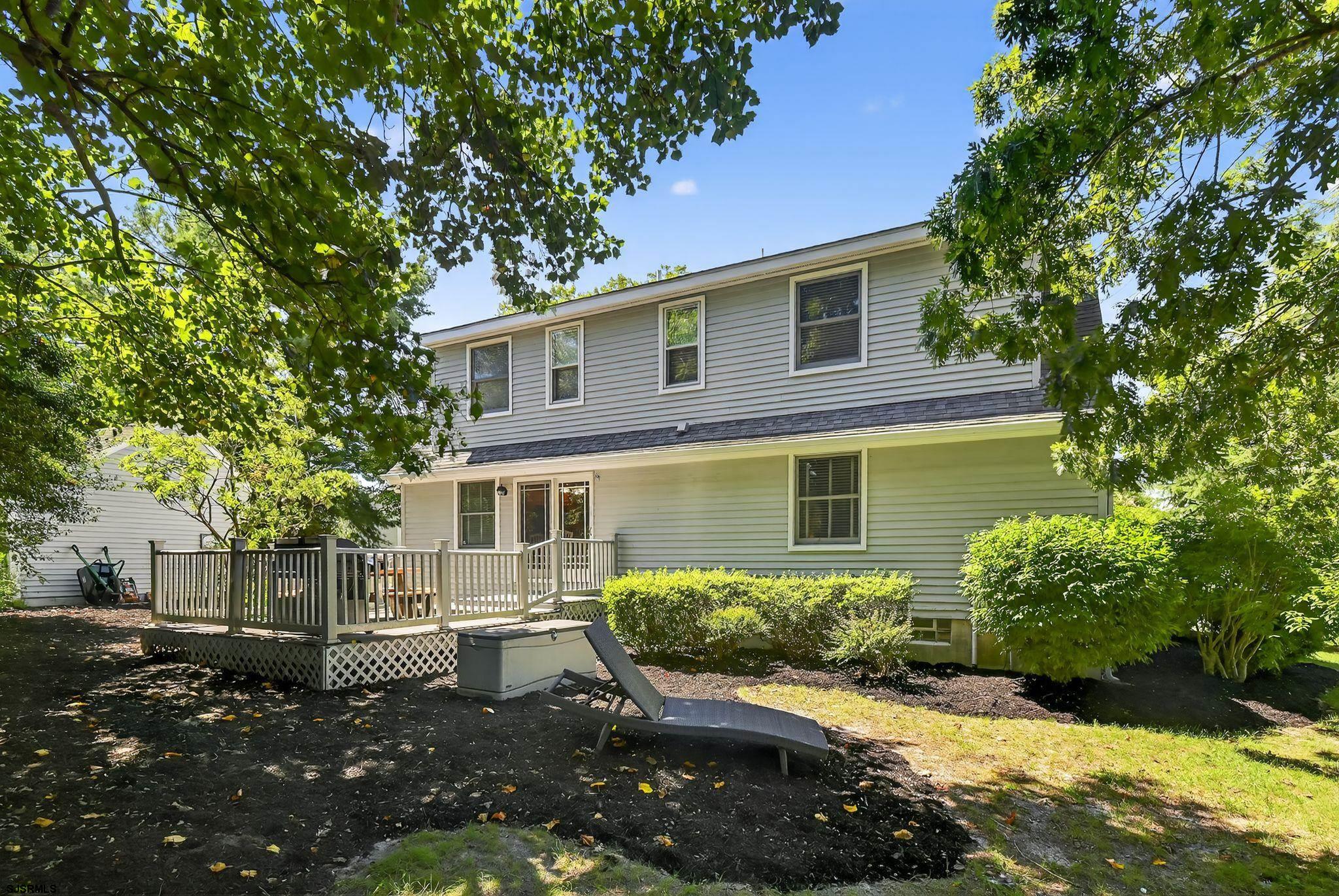 404 Cedarbrook Lane Linwood, NJ 08221 - Photo 8 of 33 a front view of a house with a yard