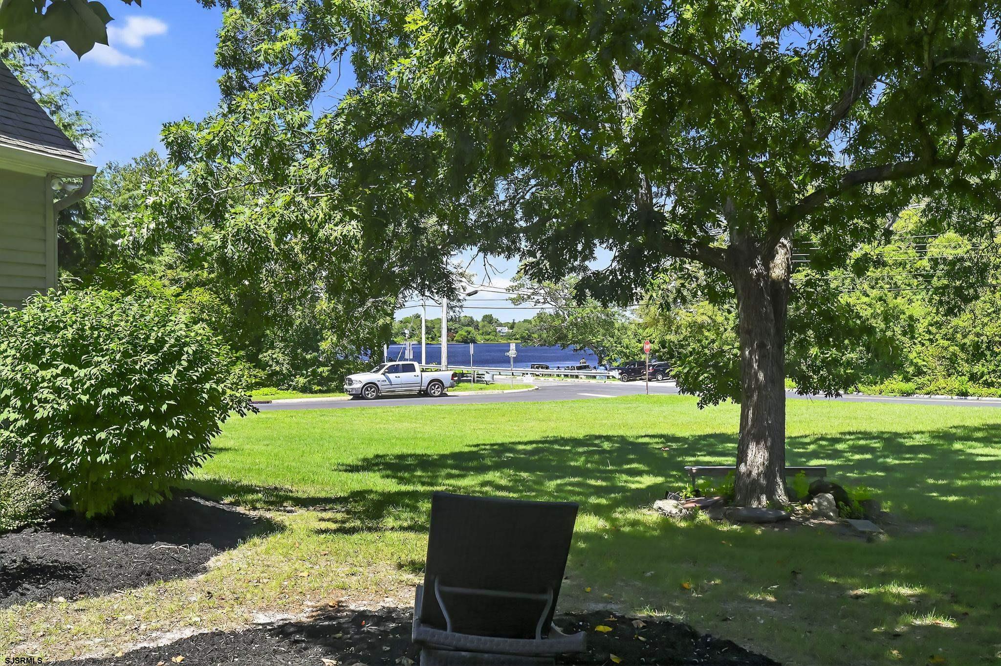404 Cedarbrook Lane Linwood, NJ 08221 - Photo 9 of 33 a view of a wooden deck with a big yard