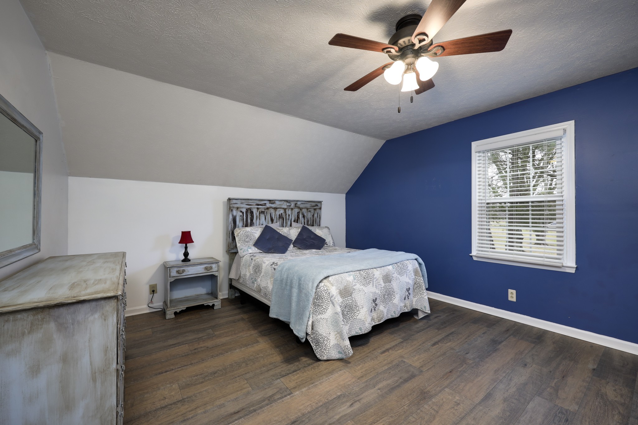 5113 Baker Road Murfreesboro, TN 37129 - Photo 1 of 17 a bedroom with bed and a chandelier