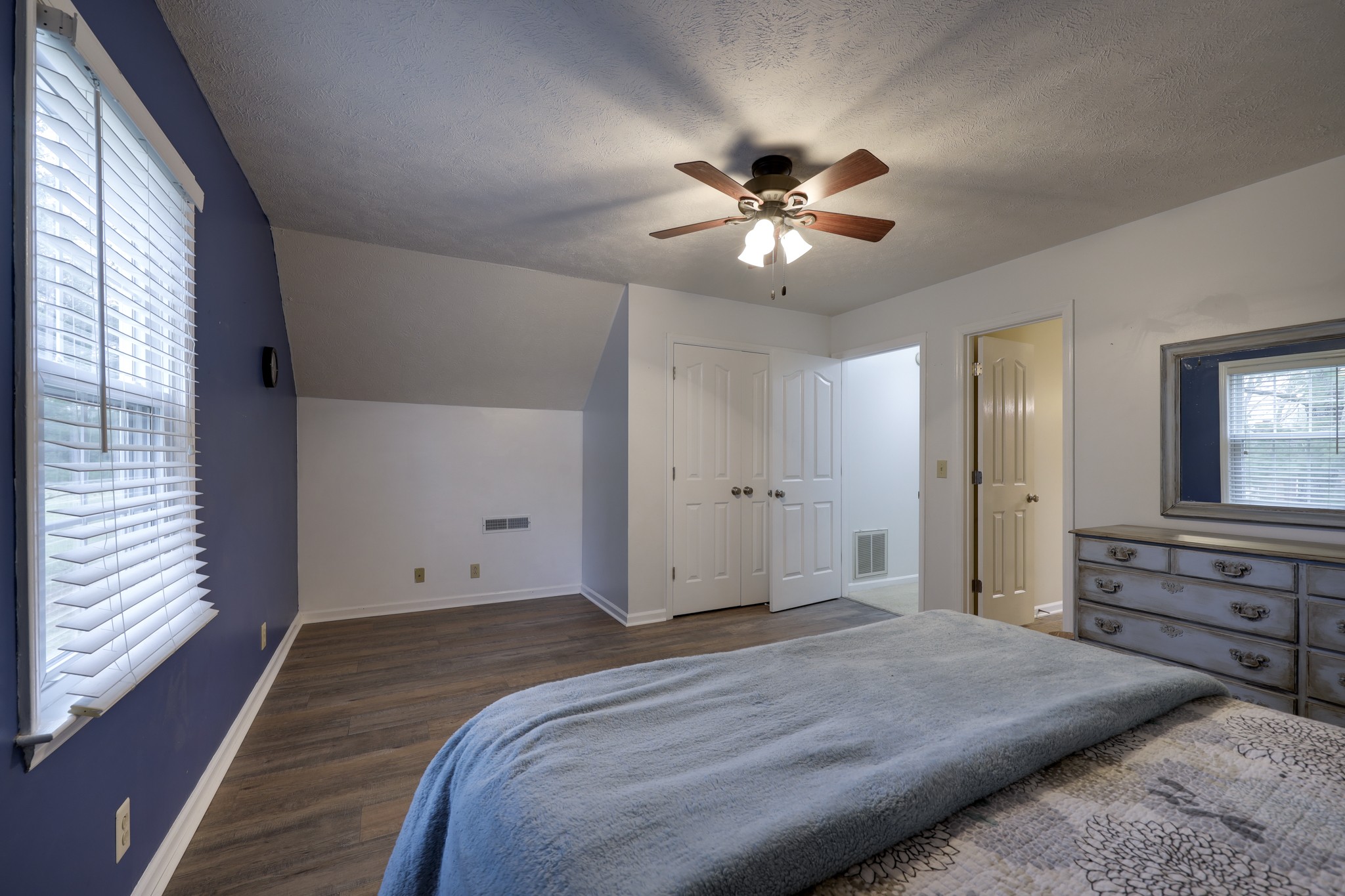 5113 Baker Road Murfreesboro, TN 37129 - Photo 11 of 17 a bedroom with a bed and a chandelier