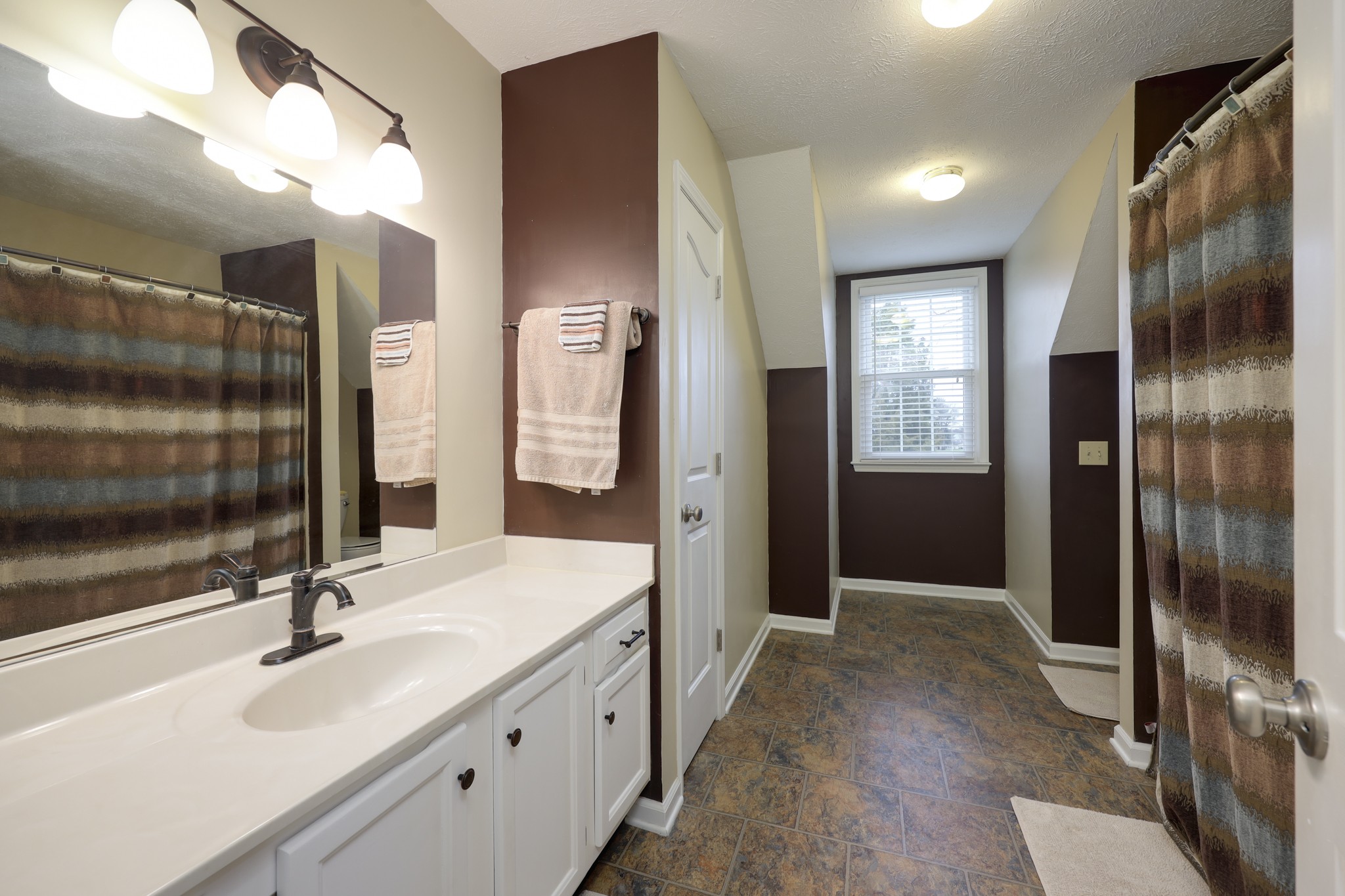 5113 Baker Road Murfreesboro, TN 37129 - Photo 12 of 17 a bathroom with a sink and a mirror