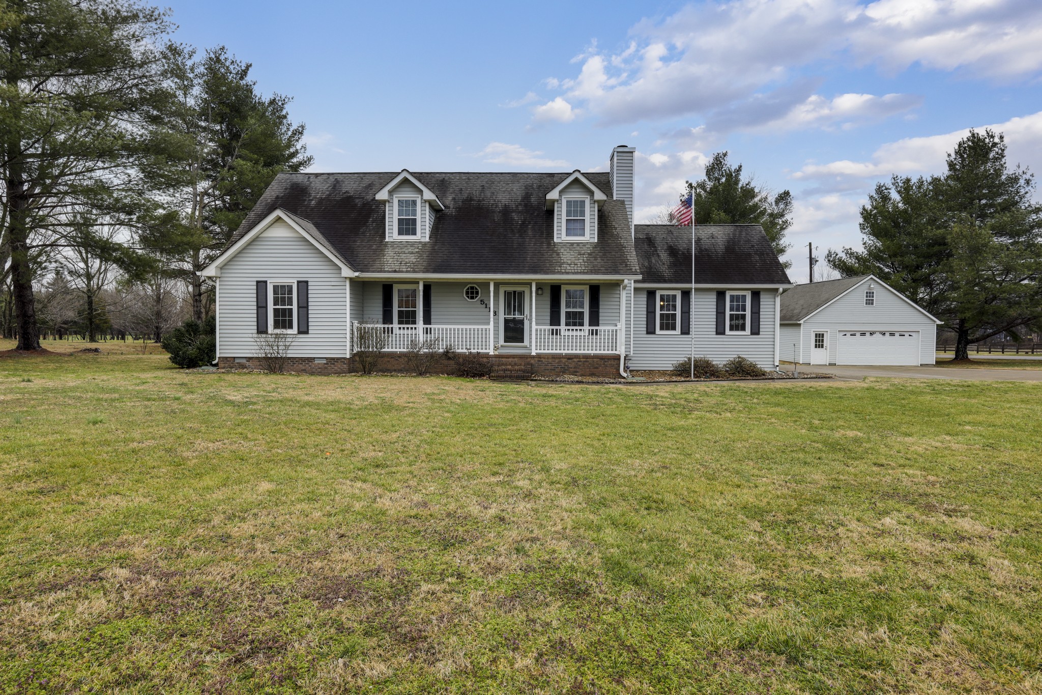 5113 Baker Road Murfreesboro, TN 37129 - Photo 16 of 17 a view of a house with a big yard and large trees