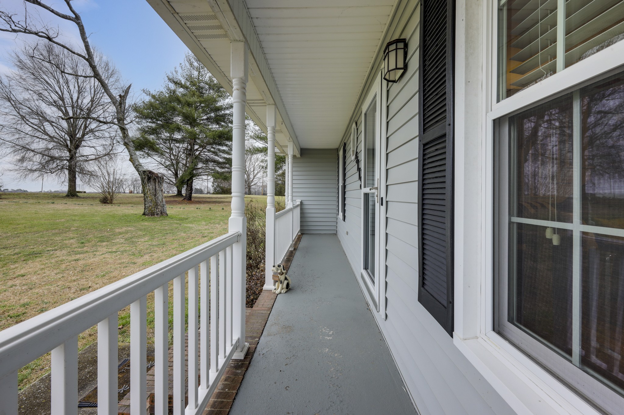 5113 Baker Road Murfreesboro, TN 37129 - Photo 2 of 17 a view of a porch with wooden floor and stairs