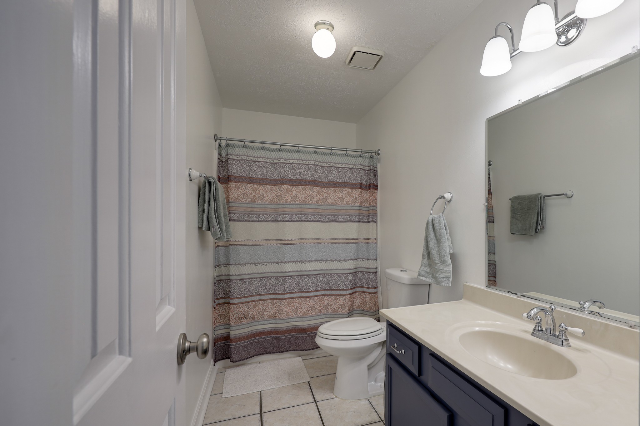 5113 Baker Road Murfreesboro, TN 37129 - Photo 5 of 17 a bathroom with a sink toilet vanity and shower