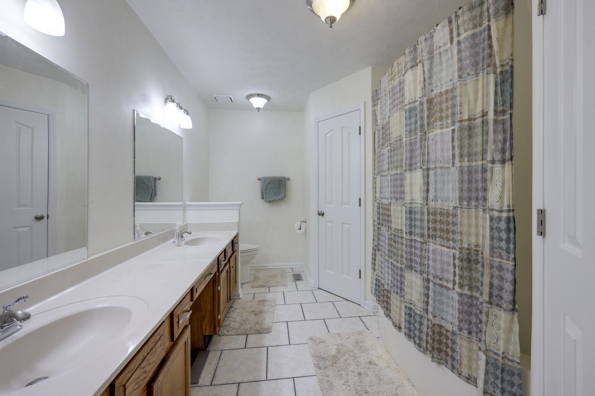 5113 Baker Road Murfreesboro, TN 37129 - Photo 6 of 17 a spacious bathroom with a granite countertop sink a mirror and shower