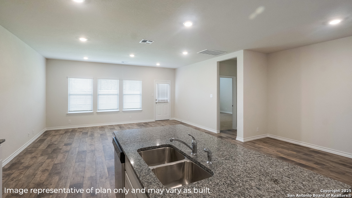 116 Hazel Peak Boerne, TX 78006 - Photo 12 of 31 an empty room with wooden floor and a sink