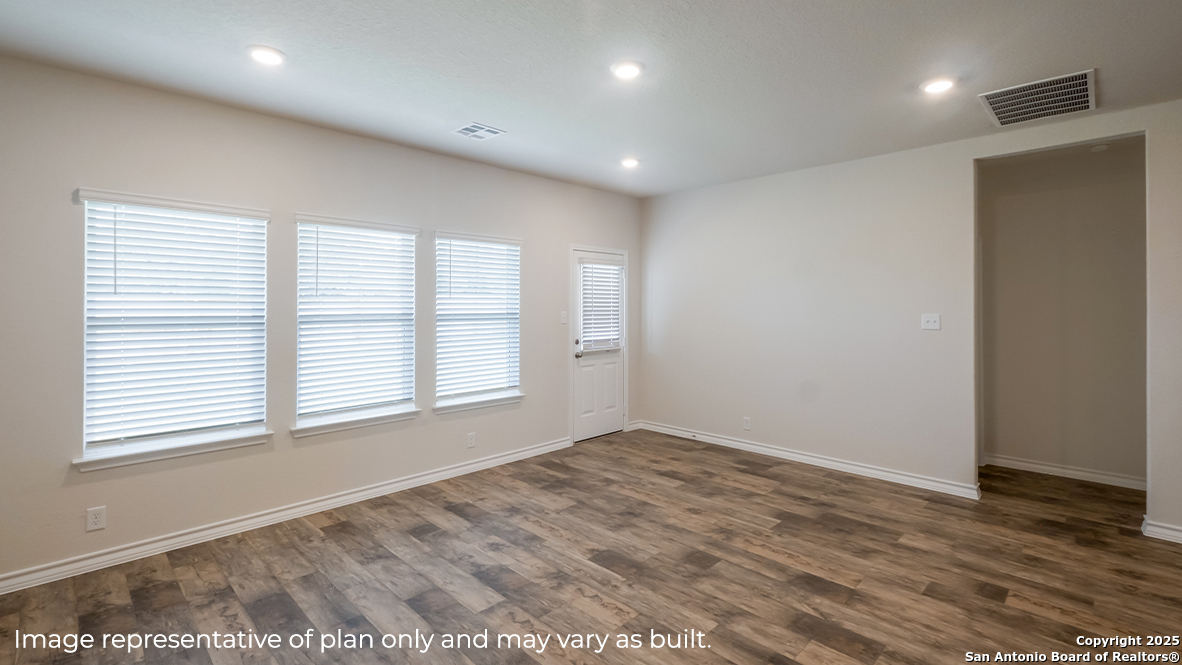 116 Hazel Peak Boerne, TX 78006 - Photo 13 of 31 a view of an empty room with wooden floor and a window