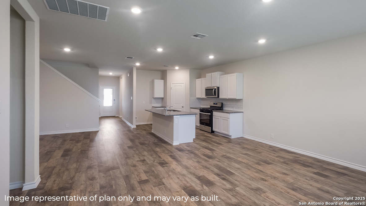 116 Hazel Peak Boerne, TX 78006 - Photo 15 of 31 a view of kitchen with kitchen island wooden floors and stainless steel appliances