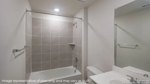 a bathroom with a shower and toilet