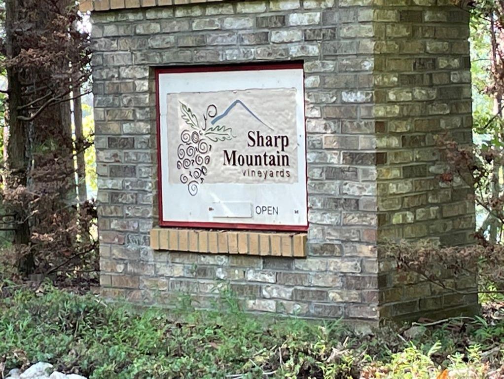 76 Tally Cv Road Jasper, GA 30143 - Photo 31 of 31 a sign on the brick wall