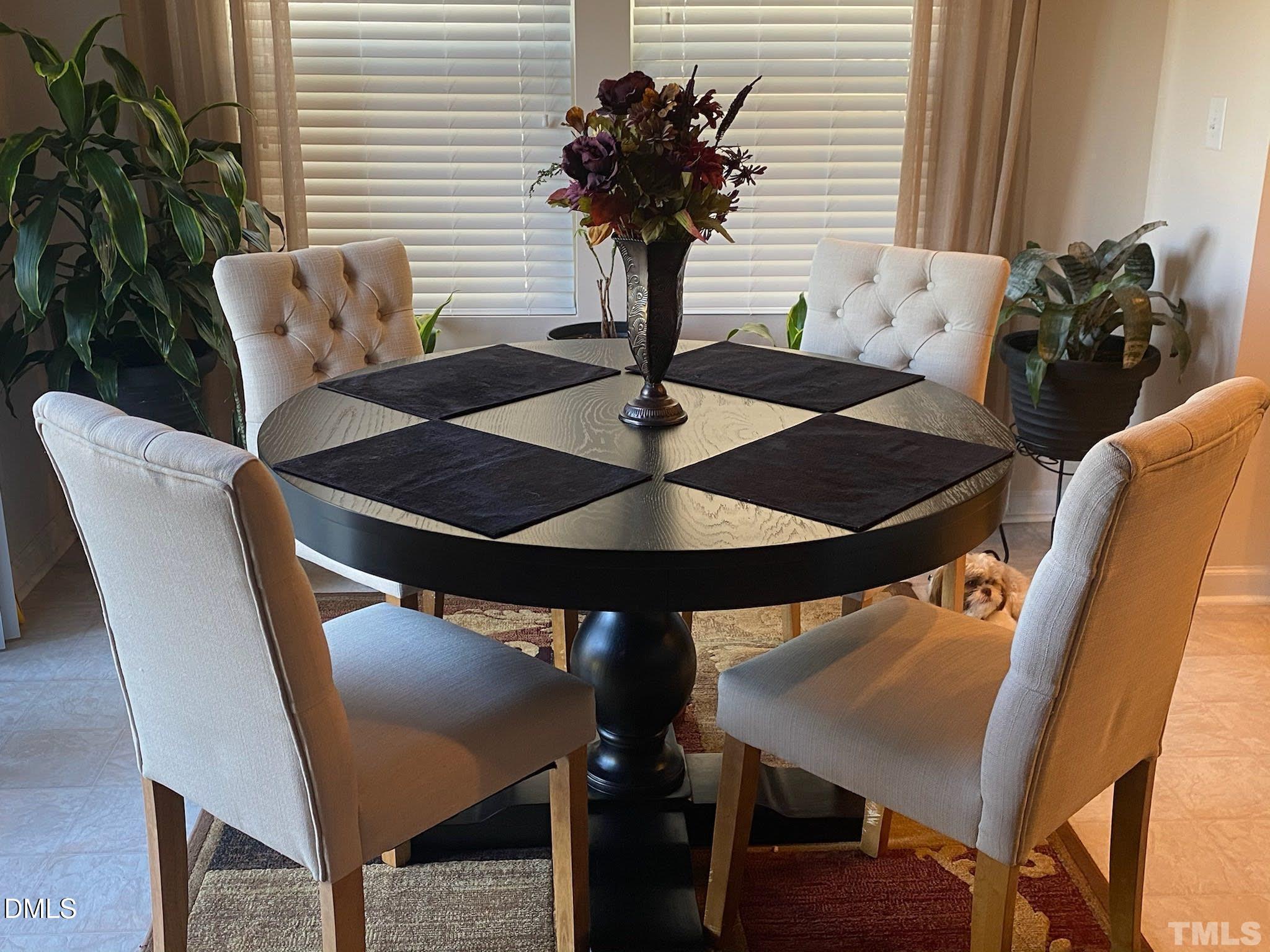 2613 Lacebark Pine Road Raleigh, NC 27616 - Photo 10 of 15 a table and chairs in a patio