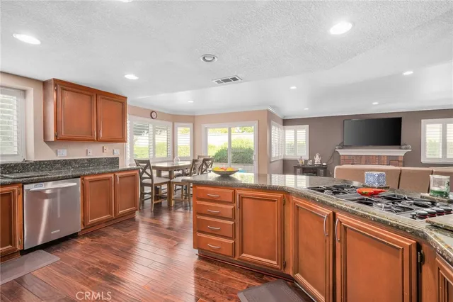 a kitchen with lots of counter top space and dining table