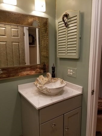 35 Hazen Road, Unit F3 Shirley, MA 01464 - Photo 7 of 22 a bathroom with a sink and a mirror
