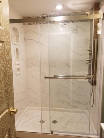 35 Hazen Road, Unit F3 Shirley, MA 01464 - Photo 8 of 22 a bathroom with a glass shower door
