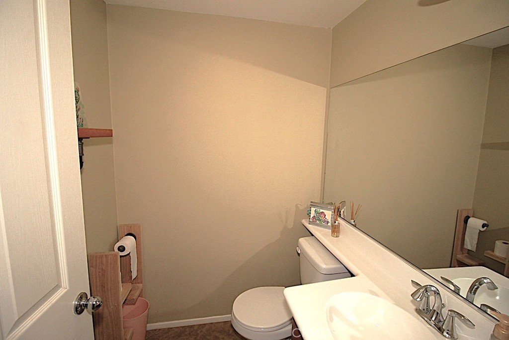 924 Condor Street Barstow, CA 92311 - Photo 15 of 52 a bathroom with a toilet and a sink