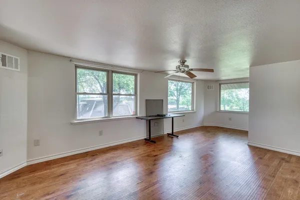 a view of a porch with wooden floor