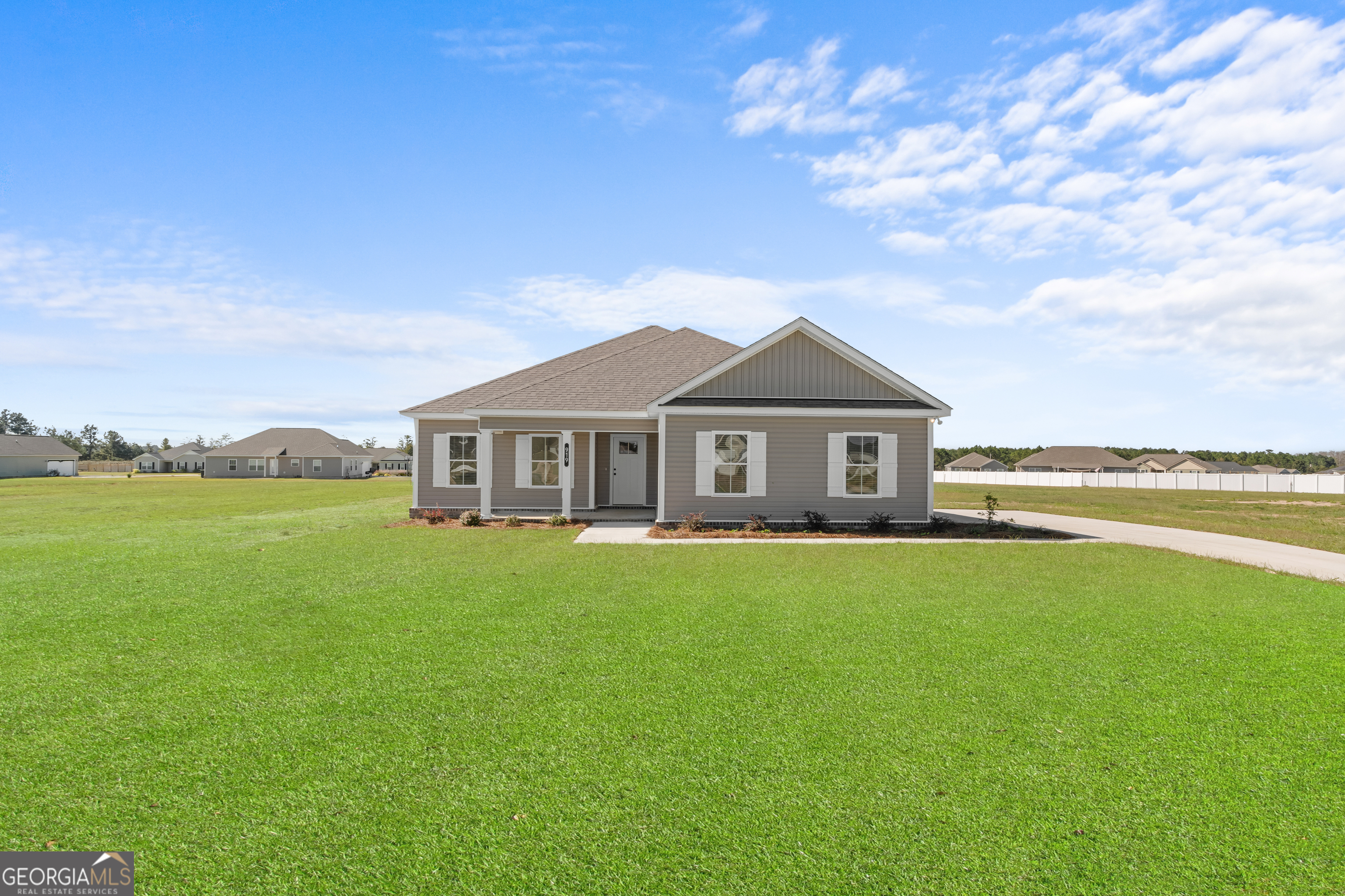 919 Ryegrass Road Statesboro, GA 30458 - Photo 1 of 20 a front view of a house with yard and green space
