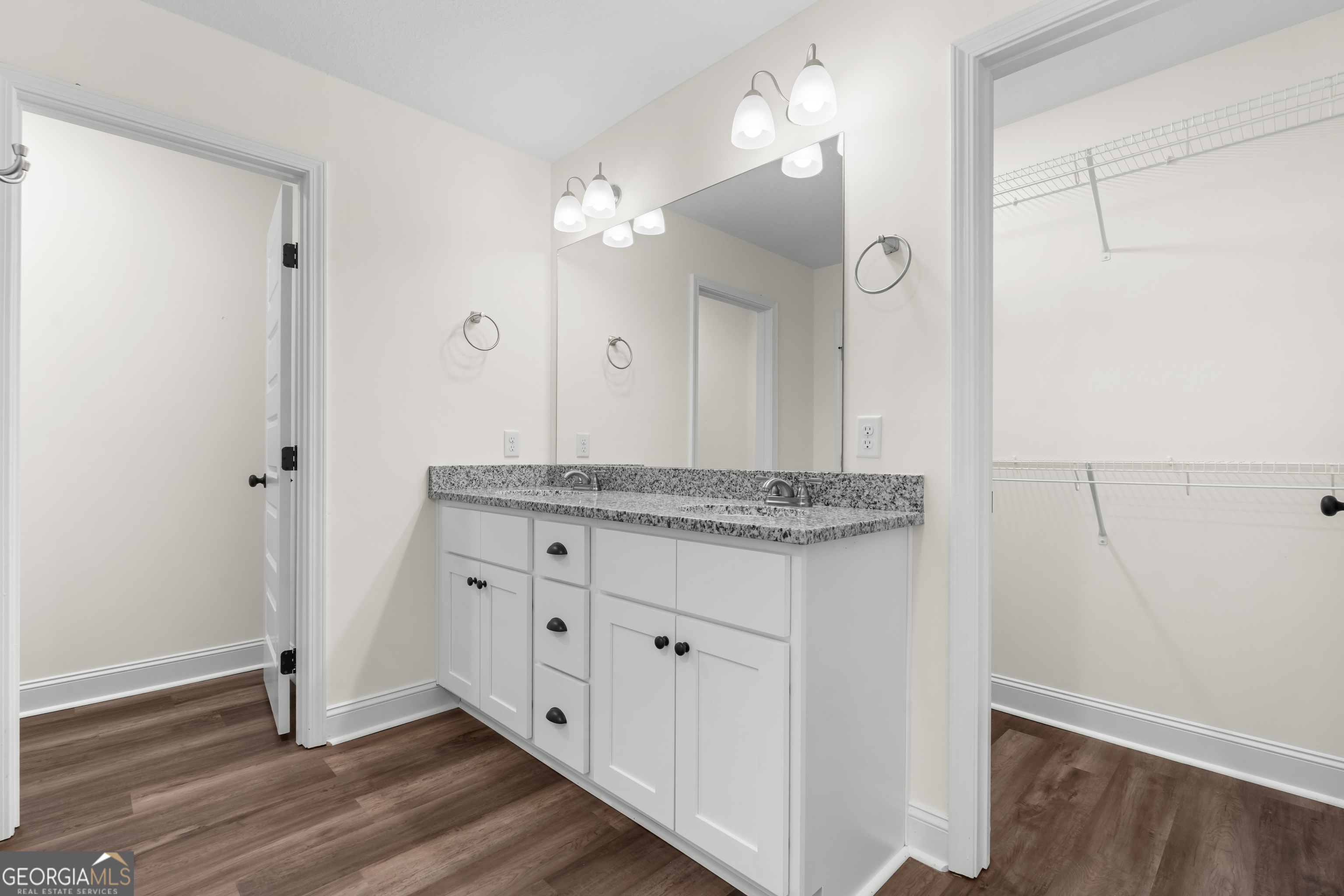 919 Ryegrass Road Statesboro, GA 30458 - Photo 12 of 20 an empty room with wooden floor and staircase