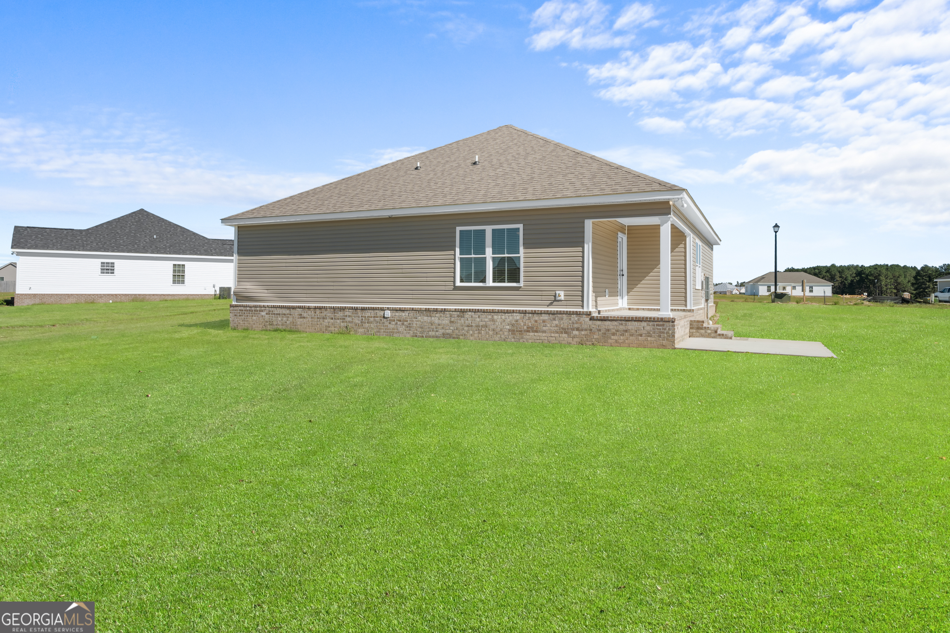 919 Ryegrass Road Statesboro, GA 30458 - Photo 19 of 20 a front view of a house with a yard