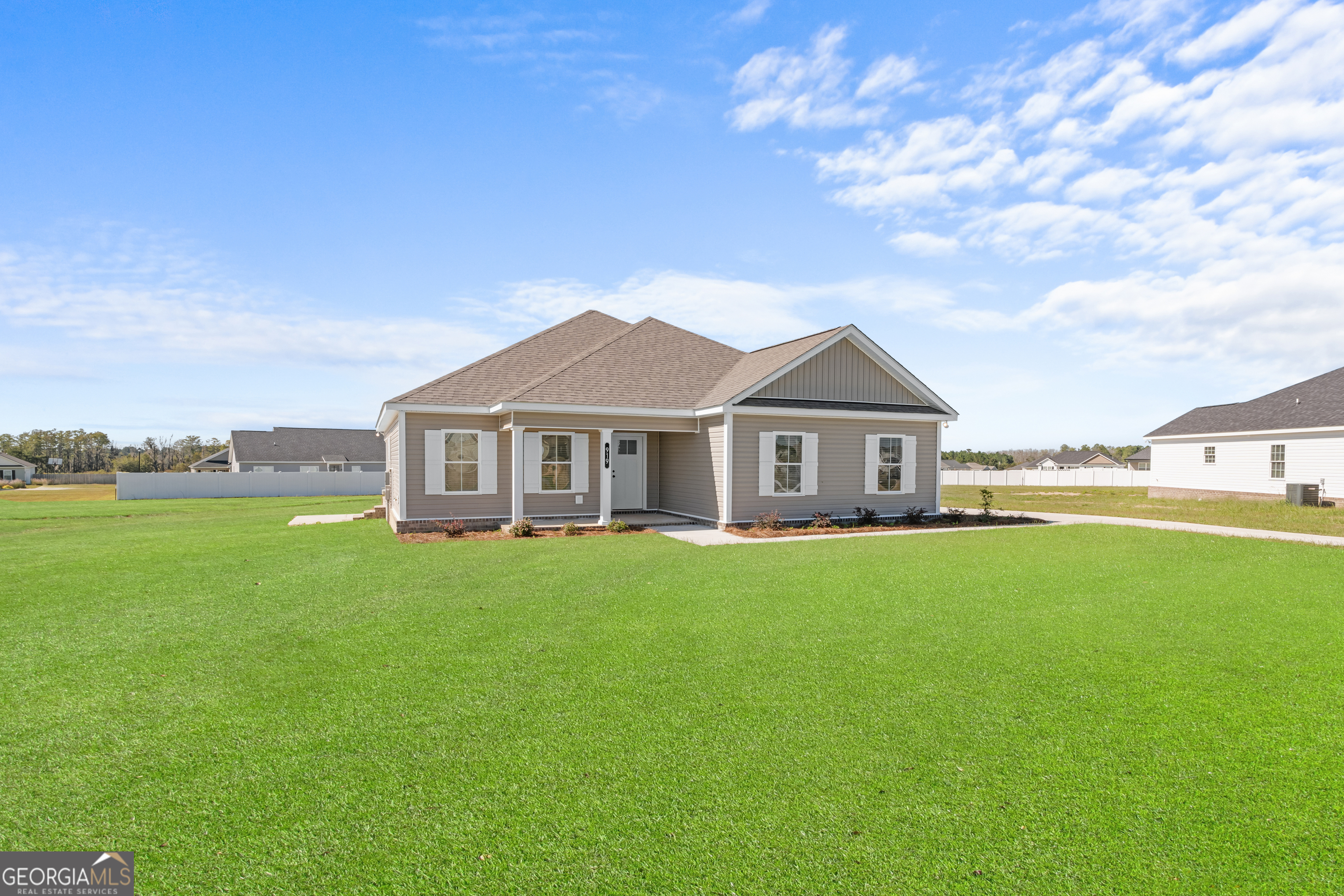 919 Ryegrass Road Statesboro, GA 30458 - Photo 3 of 20 a front view of a house with garden