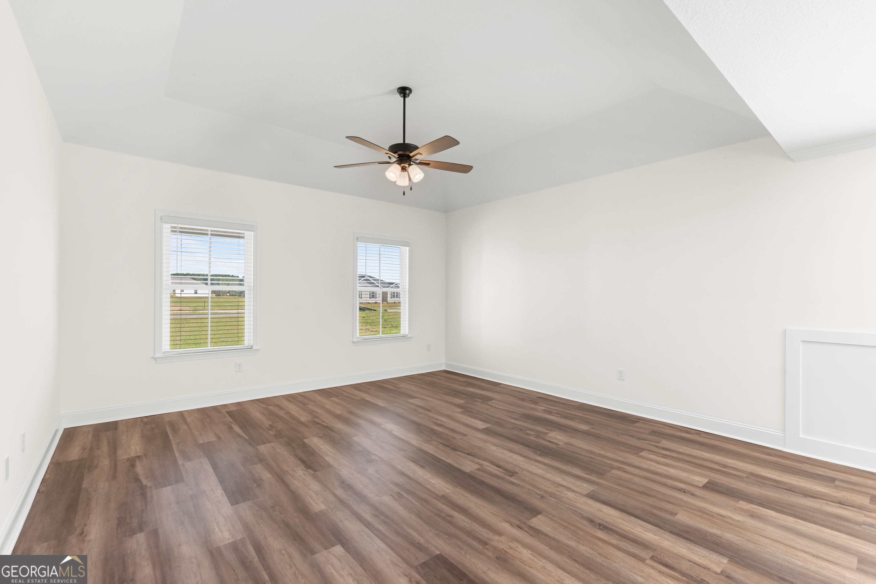 919 Ryegrass Road Statesboro, GA 30458 - Photo 6 of 20 wooden floor in an empty room with a window