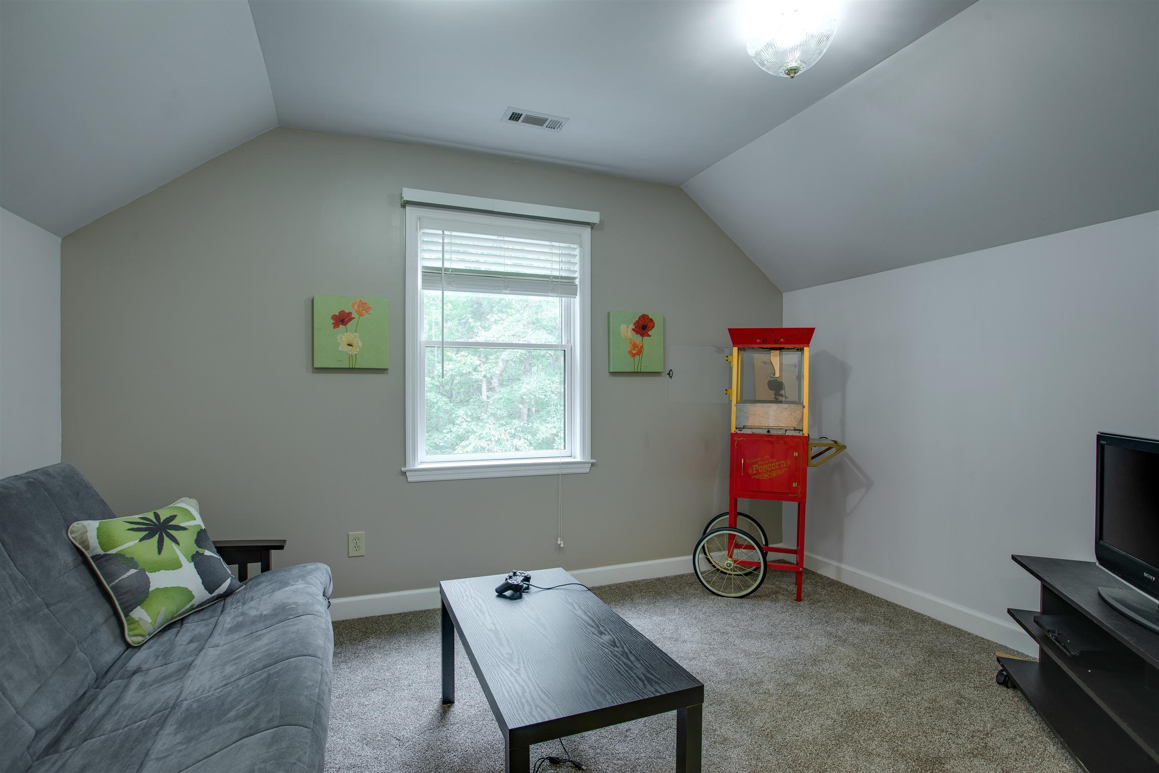 5745 Pinewood Road Franklin, TN 37064 - Photo 14 of 27 a view of a room with gym equipment and a window