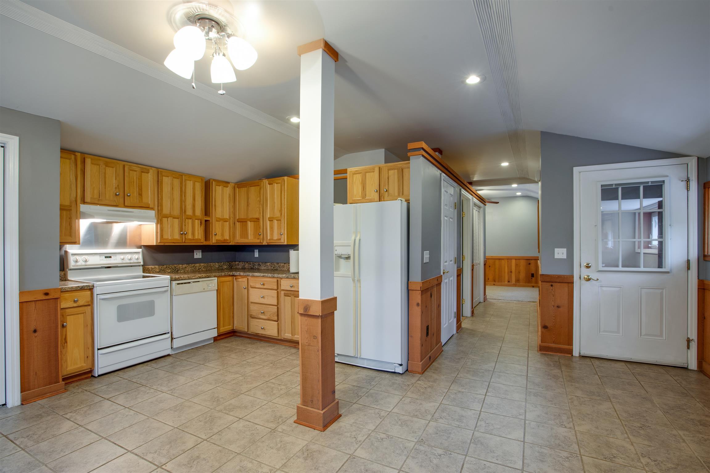 5745 Pinewood Road Franklin, TN 37064 - Photo 26 of 27 a kitchen with a refrigerator and a sink