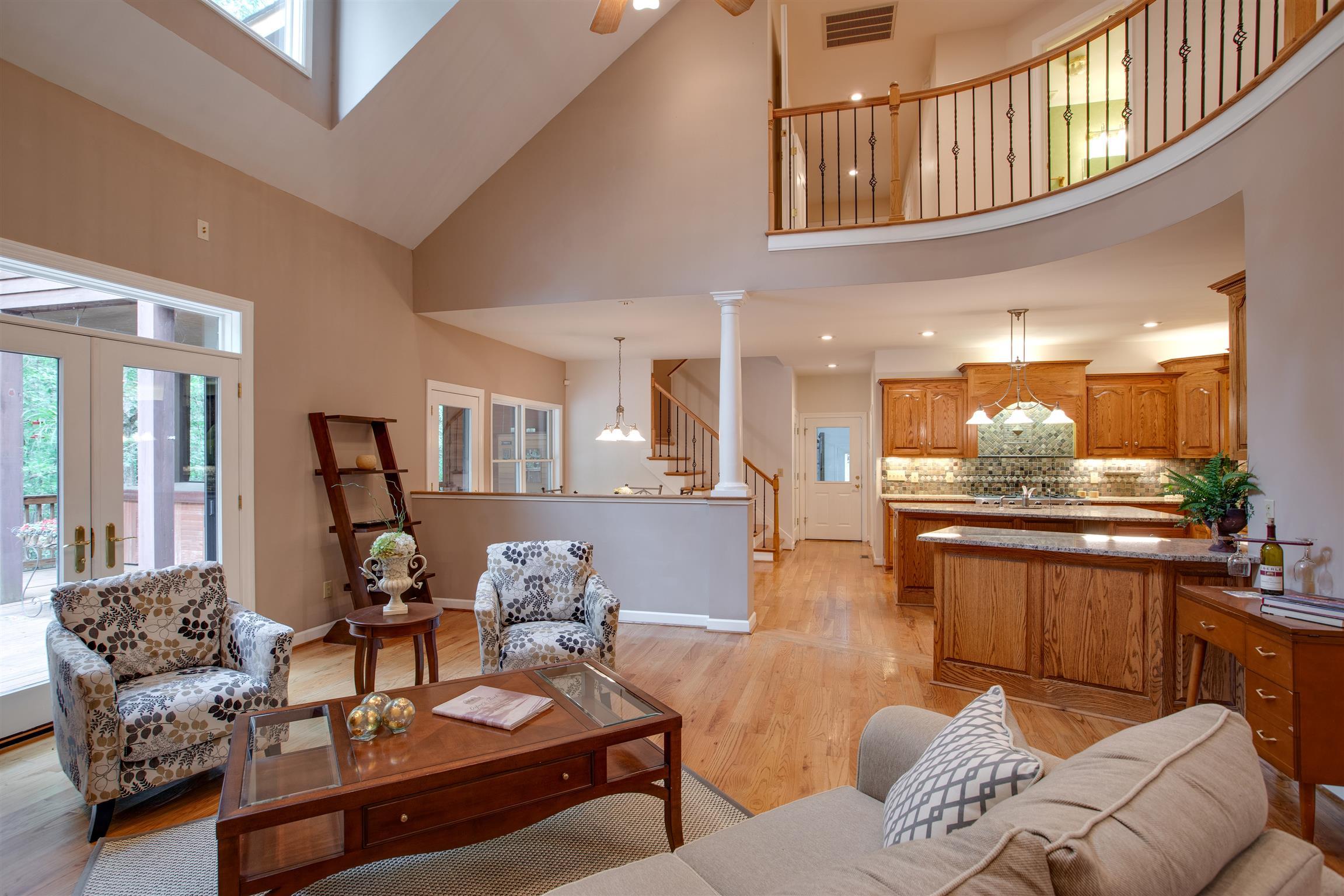 5745 Pinewood Road Franklin, TN 37064 - Photo 3 of 27 a living room with furniture and a chandelier