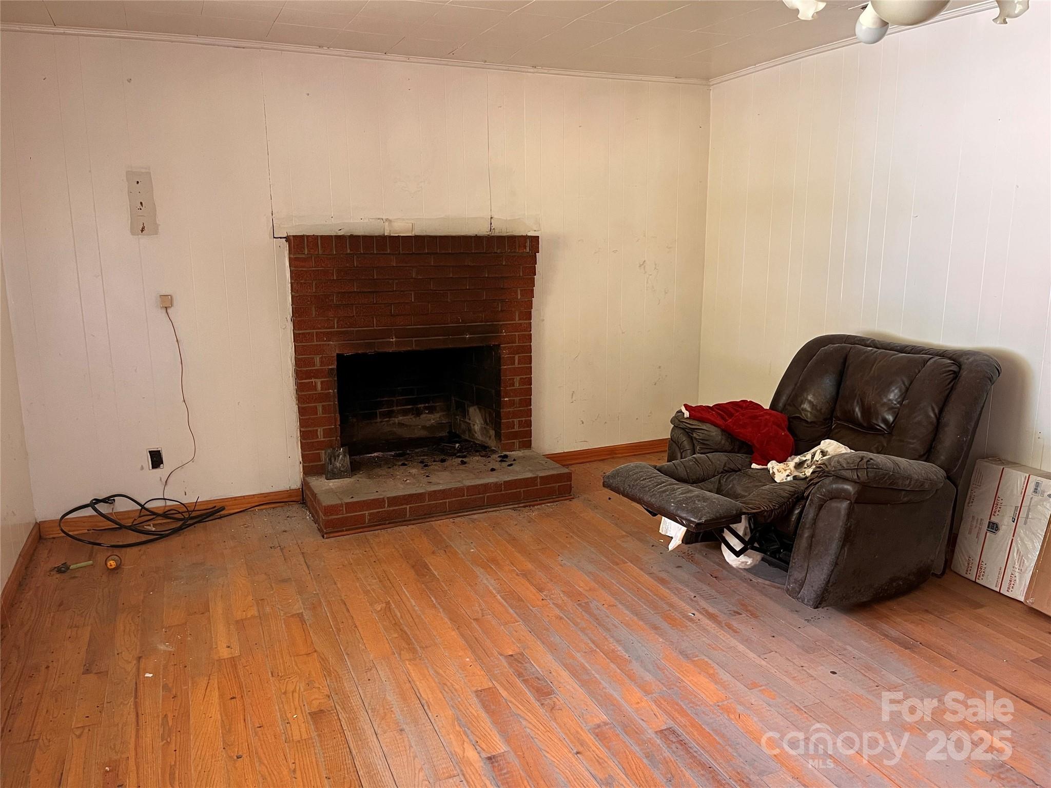 1147 Old Linville Road Marion, NC 28752 - Photo 25 of 27 a living room with furniture and a fireplace