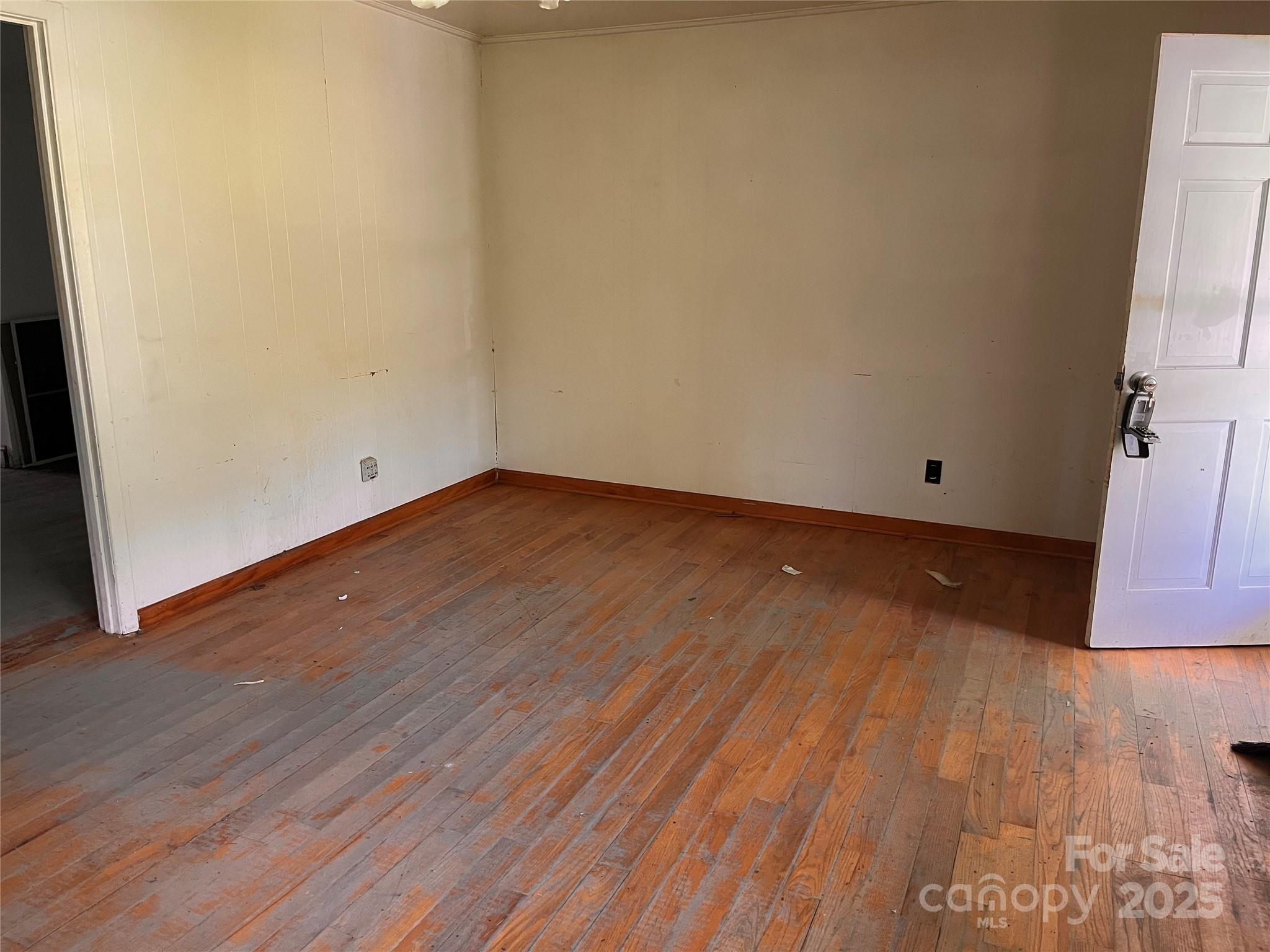 1147 Old Linville Road Marion, NC 28752 - Photo 26 of 27 a view of an empty room with wooden floor