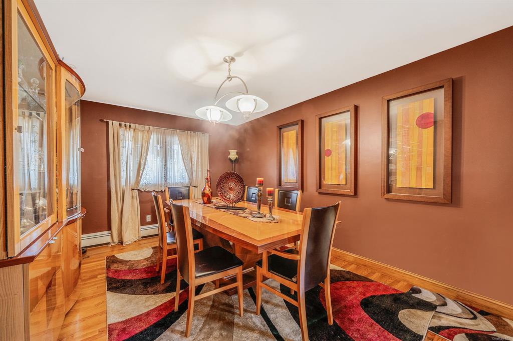 8 Brenner Road Coram, NY 11727 - Photo 14 of 43 a view of a dining room with furniture window and outside view