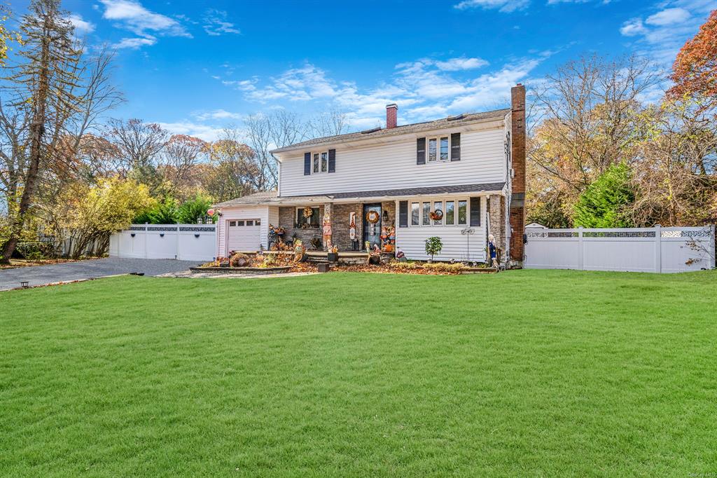 8 Brenner Road Coram, NY 11727 - Photo 2 of 43 a view of a house with a yard porch and sitting area