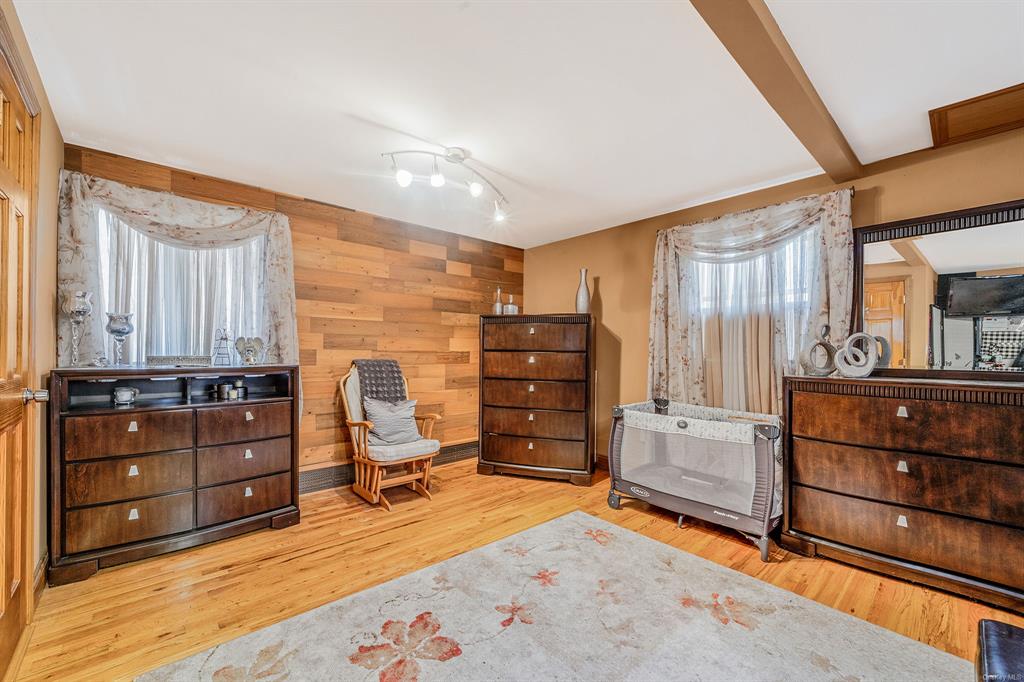 8 Brenner Road Coram, NY 11727 - Photo 21 of 43 a room with furniture and dresser