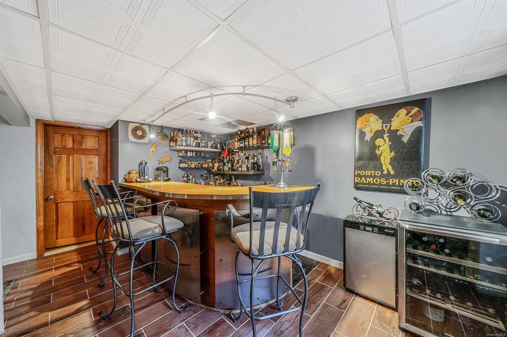 8 Brenner Road Coram, NY 11727 - Photo 27 of 43 a view of a dining room with furniture window and wooden floor