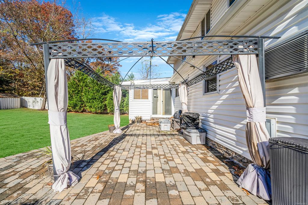 8 Brenner Road Coram, NY 11727 - Photo 35 of 43 a front view of a house with garden