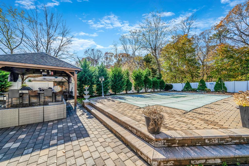 8 Brenner Road Coram, NY 11727 - Photo 36 of 43 a view of a yard with an outdoor space