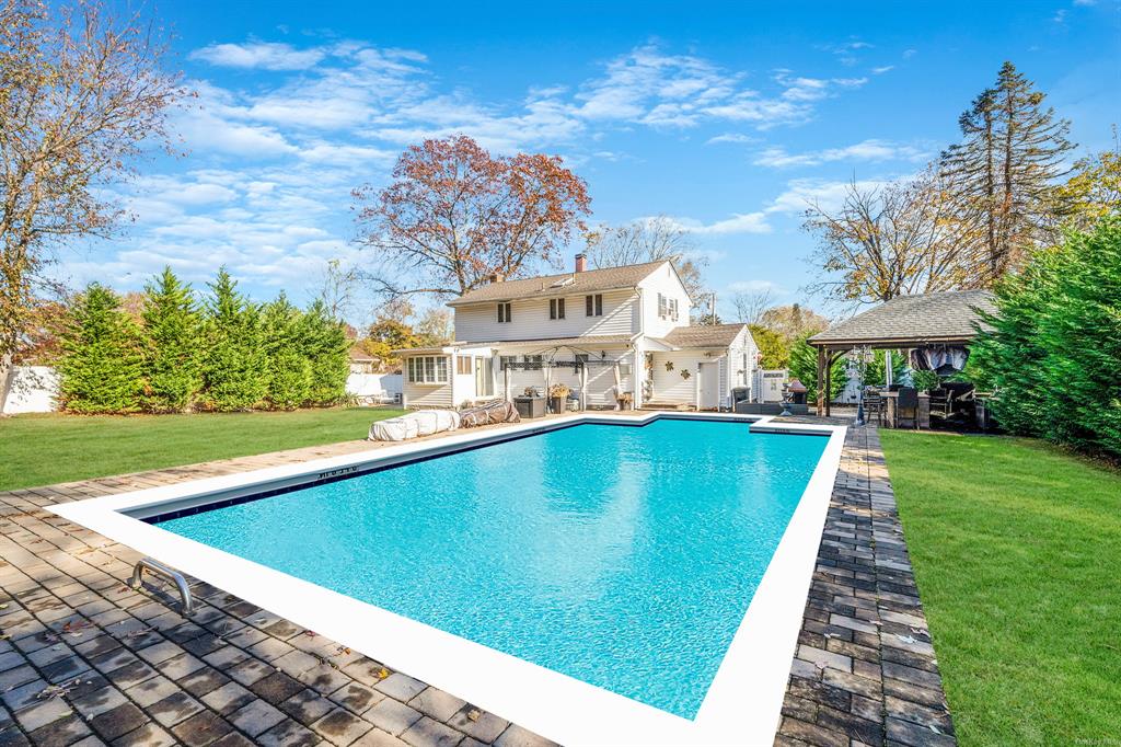 8 Brenner Road Coram, NY 11727 - Photo 40 of 43 a view of a swimming pool and a yard