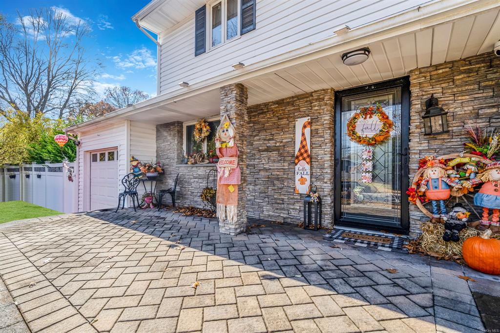 8 Brenner Road Coram, NY 11727 - Photo 4 of 43 a front view of a building with seating space