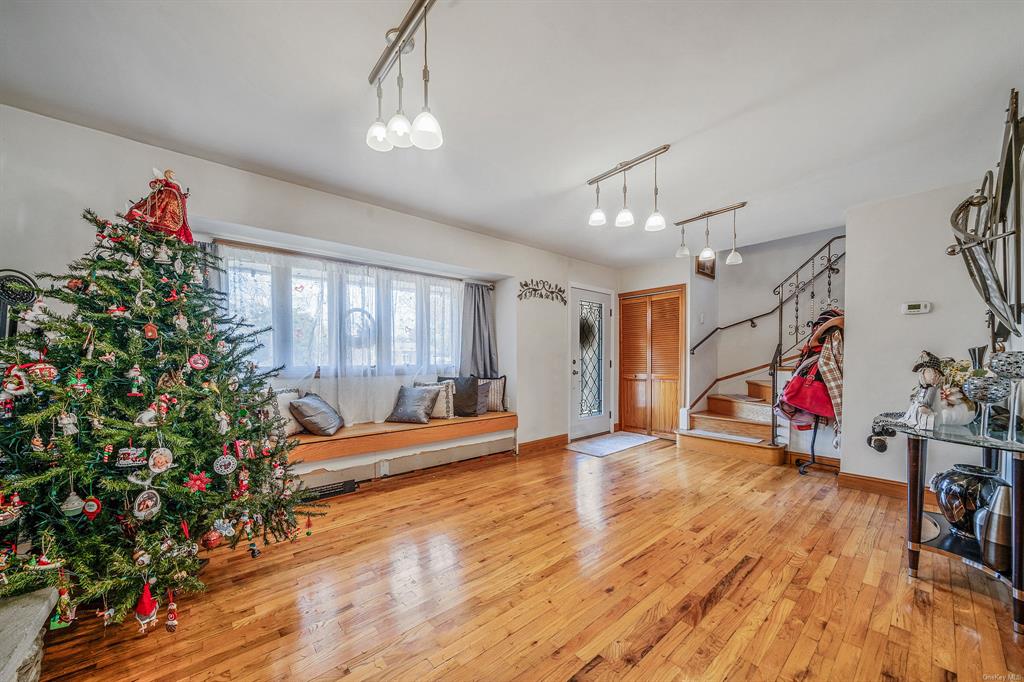 8 Brenner Road Coram, NY 11727 - Photo 8 of 43 a view of a room with wooden floor and window
