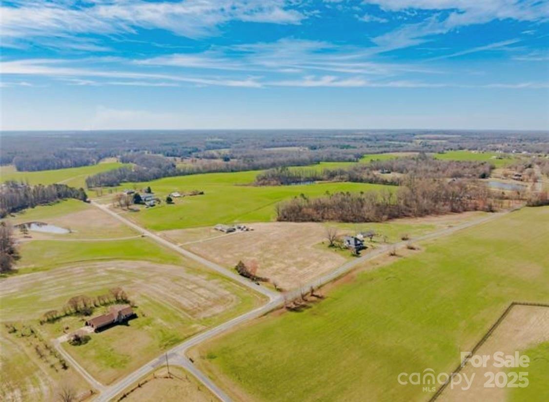 4 Faulks Church Road Wingate, NC 28174 - Photo 16 of 21 a view of a swimming pool and an ocean view